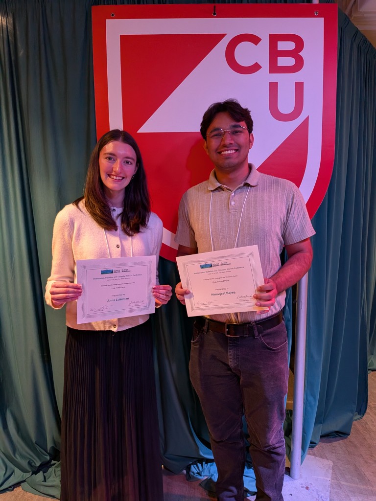 Anna and Nimar with their presentation awards